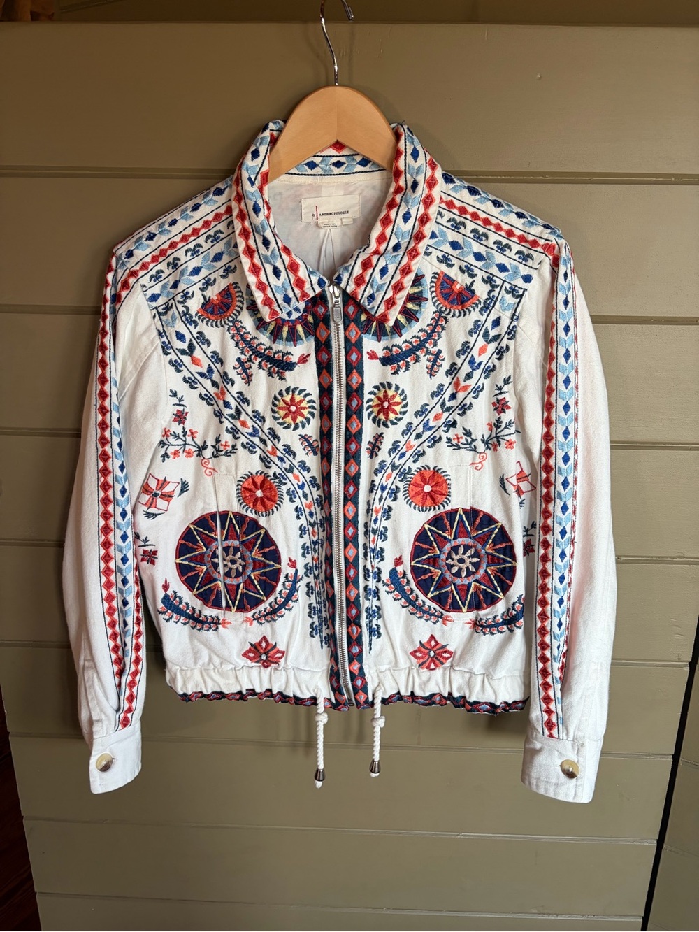 Embroidered White Zip-Front Jacket with Red & Blue Accents